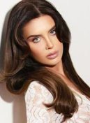 Yasmin portrait thumbnail, long brunette hair and white lace top