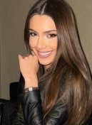 Eduarda thumbnail - smiling brunette in a black leather jacket