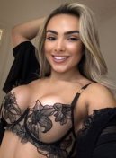 Karli thumbnail - busty Latin escort London in a black floral lace bra